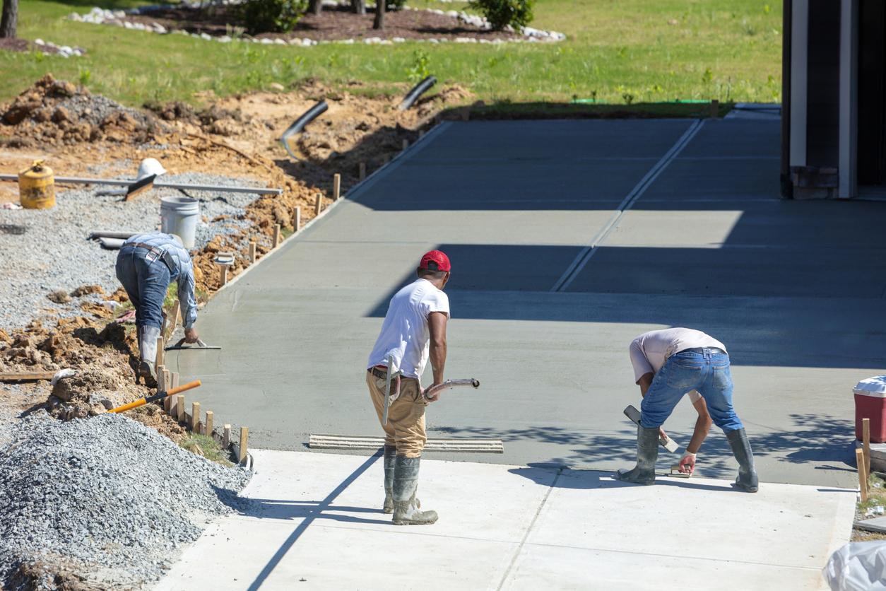 hispanic-men-working-on-a-new-concrete-driveway